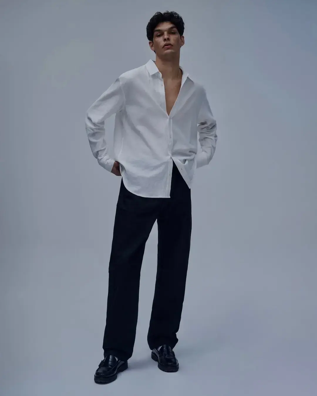 Editorial portrait in minimalist studio setting