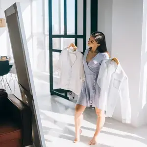 Customer choosing between garments during a virtual styling moment